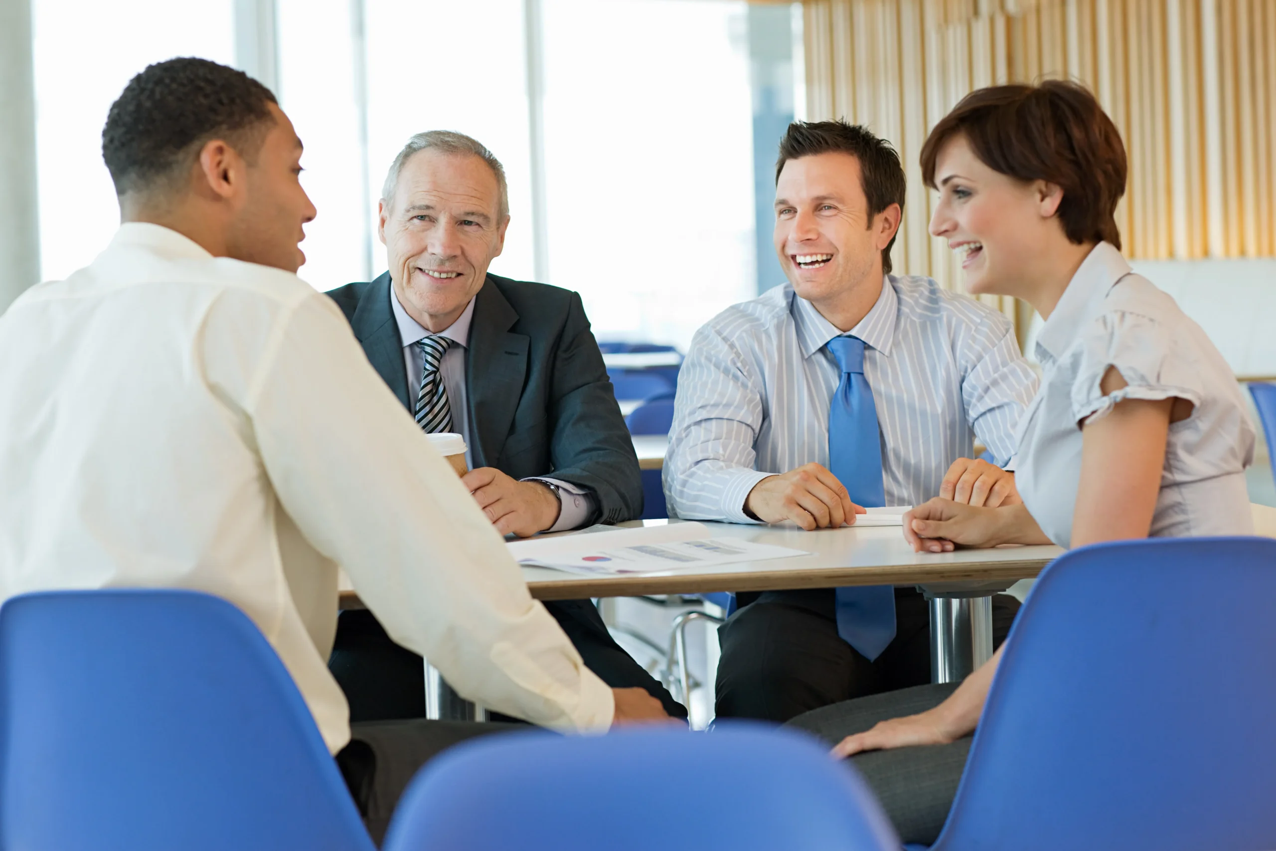 four-business-professionals-enjoying-a-meeting-tog-2026-01-09-08-44-17-utc